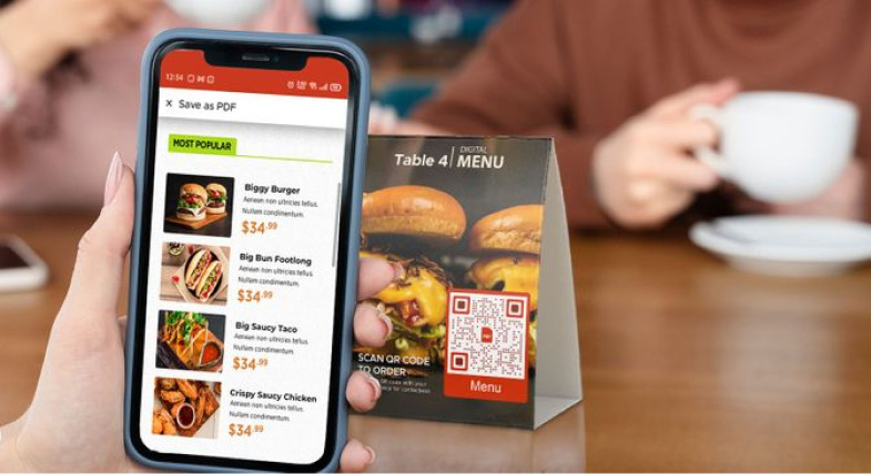 A person scanning the QR Code on the table and viewing the restaurant menu on his mobile phone