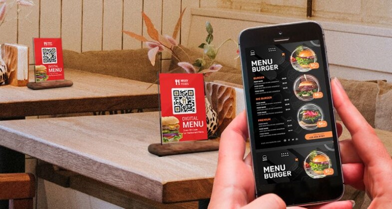 A person scanning the QR Code on the table and viewing the restaurant menu on his mobile phone